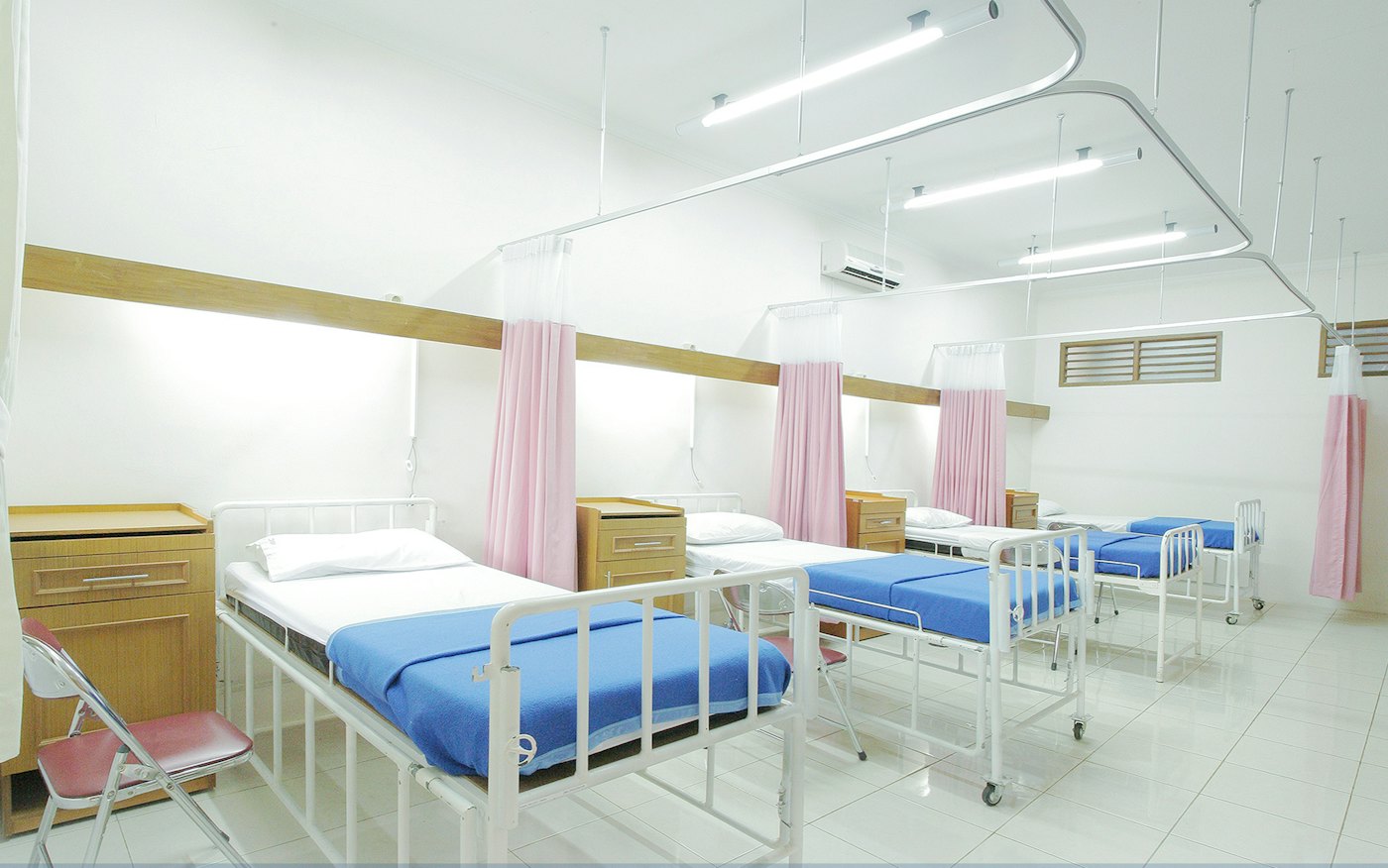 A clean hospital ward with made beds